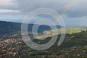 Rainbow over Soller Valley surrounded by the Serra deÂ TramuntanaÂ mountains